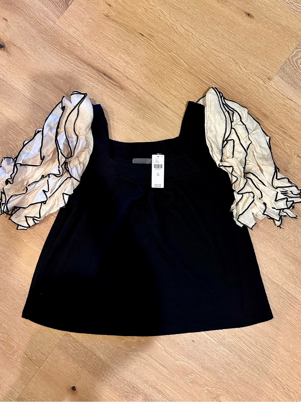 Anthropologie Black Top with Ivory Ruffled Puff Sleeves